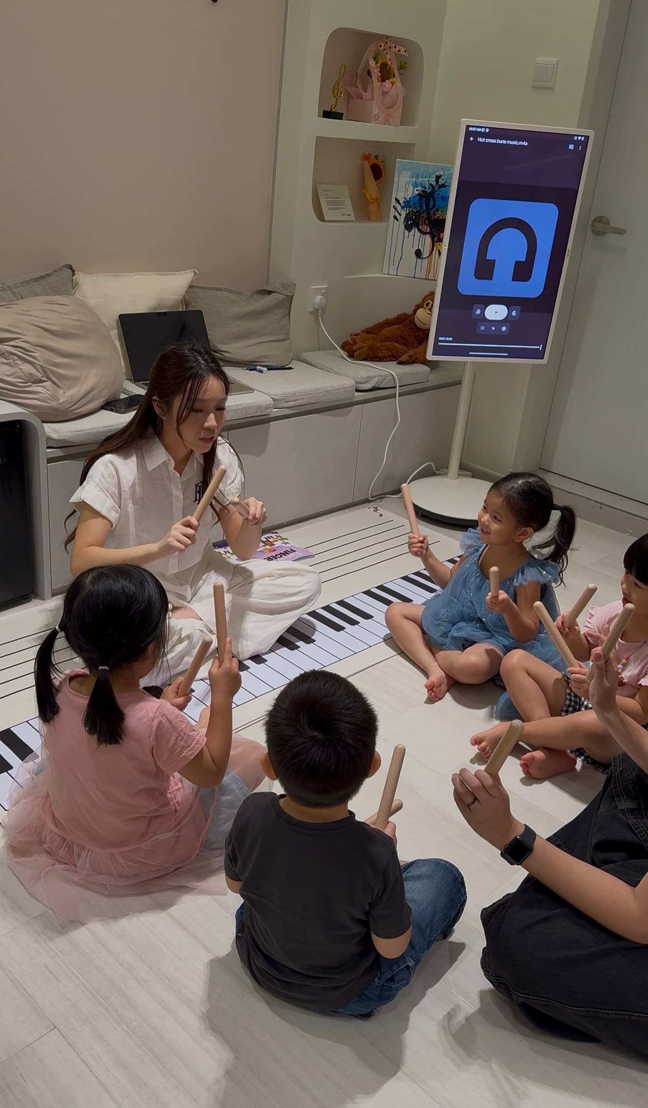 A Polaris teacher leading a group class of young children