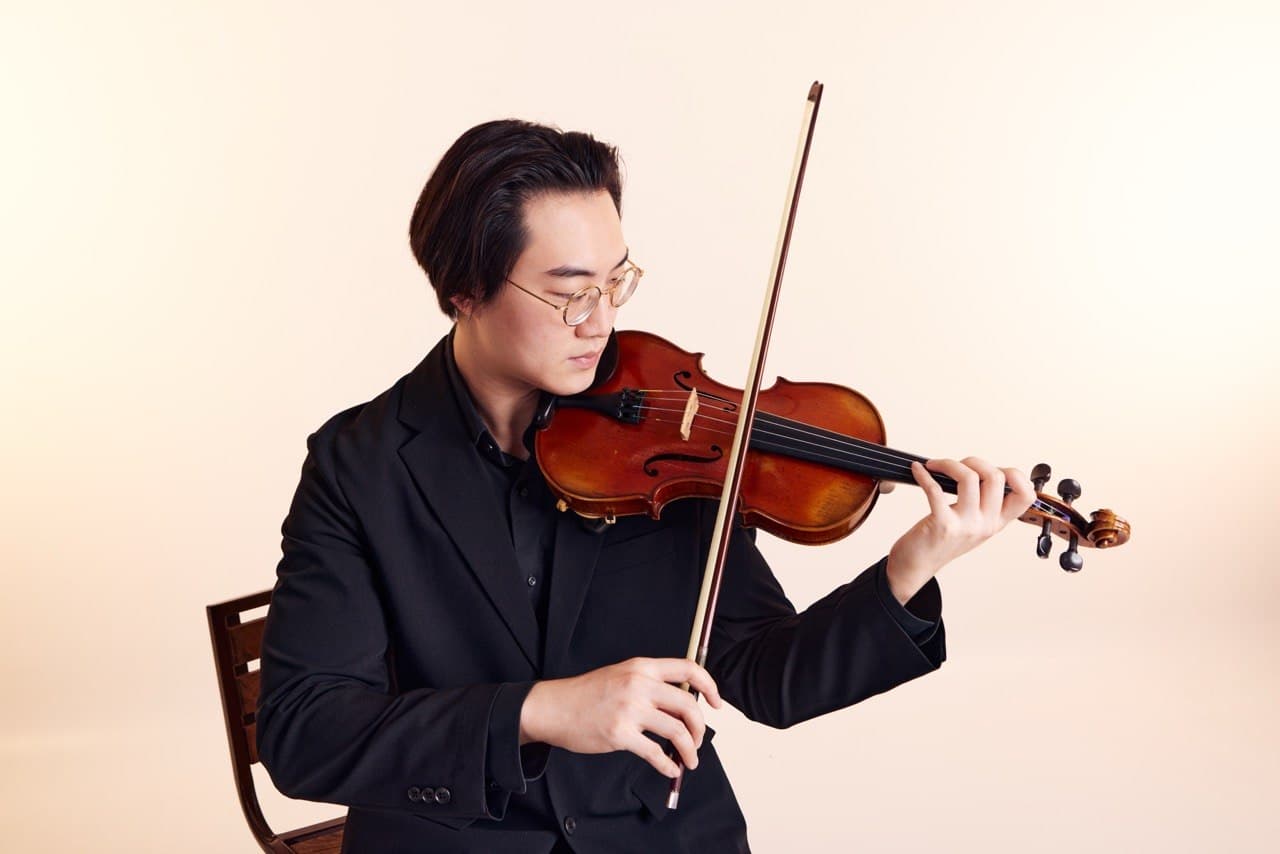 Teacher Oliver playing the violin