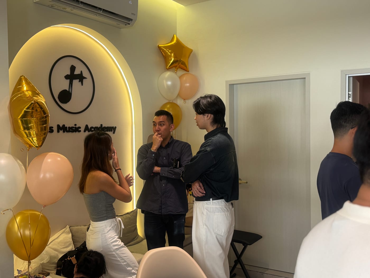 Guests chatting around the studio during the official opening